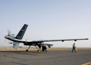 Aircrews perform a preflight check on an MQ-9 Reaper before it takes of for a mission in Afghanistan Sept. 31. The Reaper is larger and more heavily-armed than the MQ-1 Predator and in addition to its traditional ISR capabilities, is designed to attack time-sensitive targets with persistence and precision, and destroy or disable those targets. (Courtesy photo)