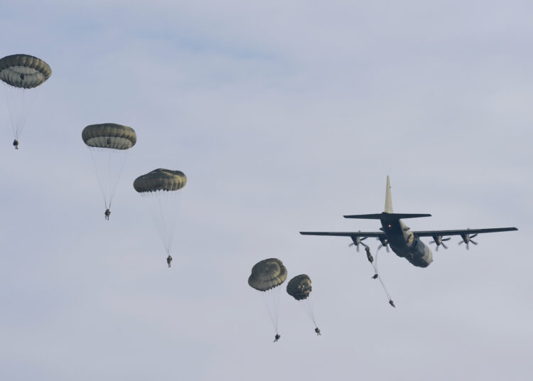 Paratroopers with 16 Air Assault Brigade jump from a Royal Air Force Hercules aircraft over Salisbury Plain, Wiltshire during Exercise Wessex Storm.

The British Army's airborne and armoured reaction forces came together, with the fast and light forces of 16 Air Assault Brigade training with the slower but more powerful troops from 12 Armoured Infantry Brigade.

Exercise Wessex Storm saw the airborne infantry of C Company, 3rd Battalion The Parachute Regiment (3 PARA) and the Apache attack helicopters of 4 Regiment Army Air Corps work alongside 1st Battalion Scots Guard, a mechanised infantry unit.