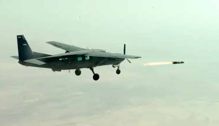 An Iraqi Air Force pilot fires an AGM-114 Hellfire air-to-ground missile from a Cessna AC-208 Combat Caravan above the Aziziyah test fire range in Iraq on November 8, 2010. Image: Sgt. Brandon Bolick