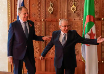 Russian Foreign Minister Sergei Lavrov and Algerian Foreign Minister Ramtane Lamamra walk during their meeting in Algeria on Tuesday. (Reuters)