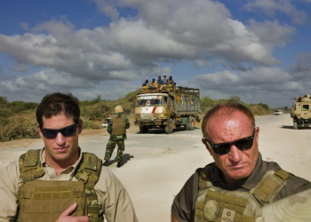 Somalia, Mogadishu 2013
Mike Stock, president of Bancroft and one of his staff Richard Rouget stand approx 25km from the capital of Mogadishu on the road to Afgoye, securing this road is a great challenge as it will be the supply route to the west of the country.CREDIT: Dominic Nahr/Magnum Photos for The Wall Street Journal
