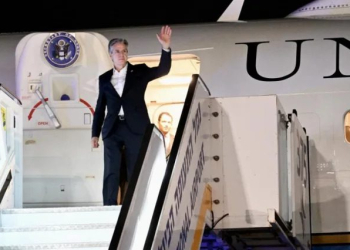 U.S. Secretary of State Antony Blinken waves Monday as he disembarks from his plane after landing at Ben Gurion Airport, outside Tel Aviv, Israel. Blinken's official visit to Israel, his fourth since the October 7 Hamas attack, is part of his trip to the region. U.S. Embassy Jerusalem handout photo by David Azagury for EPA/EFE