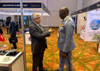Havelsan's International Business Development Manager for Africa VUROL EROL speak with military delegates during the 4th African Air Forces Forum in Lagos, Nigeria.
