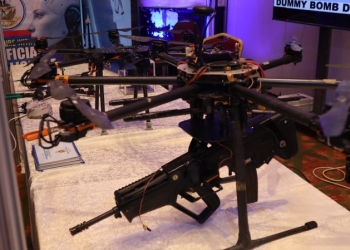 rifle-armed nigeria hexacopter drone