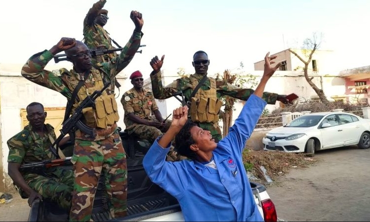 Sudanese citizens celebrate in Port Sudan, Sudan, following an announcement by the army that it had taken the city of Wad Madani, on January 11. (Ibrahim Mohammed Ishak/Reuters)