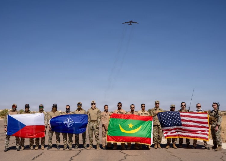 A U.S. Air Force B-52H Stratofortress assigned to the 96th Expeditionary Bomb
Squadron is flown over Czech Special Forces, Mauritanian pilots, and U.S. Forces as part of Bomber Task Force 26-1 and a close air support training event in Atar, Mauritania, November 19, 2025. (U.S. Air Force photo by Tech Set. Katelvnn Moeller)