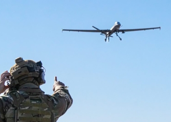 A U.S. Air Force Airman assigned to the 1st Special Operations Support Squadron Mission Sustainment Team watches as an MQ-9 Reaper prepares to land on an unprepared dirt surface at Melrose Air Force Range, New Mexico, Dec. 16, 2024. Exercise Reaper Castillo validated the MQ-9’s ability to conduct key operations in austere environments, including dirt-strip landings, refueling, rearming and rapid relaunch. (U.S. Air Force photo by Airman 1st Class Gracelynn Hess)