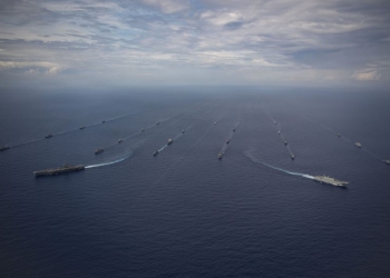 Twenty-six ships from 13 partner and allied nations steam in formation with Nimitz-class aircraft carrier USS Nimitz (CVN 68) during a multinational maritime exercise as part of Fleet Exercise (FLEETEX) 250 in the Atlantic Ocean, June 25, 2026. Nimitz is underway taking part in FLEETEX 250, a series of structured multilateral training events at-sea, aimed at building cohesiveness, validating tactical procedures, and strengthening the interoperability of participating units—which include warships, aircraft, and crews from the U.S. and 13 partner and ally nations. (U.S. Navy photo by Mass Communication Specialist Seaman Julian Jaime)