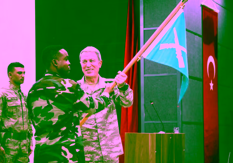 Turkish military chief of staff General Hulusi Akar and a Somali soldier participate during the opening ceremony of a Turkish military base in Mogadishu, Somalia September 30, 2017 REUTERS/Feisal Omar Purchase Licensing Rights