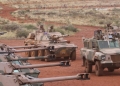 A Mamba mine resistant ambush protected armoured personnel carrier and Rooikat armoured reconnaissance car position themselves in front of a row of Ratel 90 infantry fighting vehicles, at South African Army Combat Training Centre Lohatlha's Mount Huxley during the Exercise VUKUHLOME IV 2025 Distinguished Visitors Day capability demonstration.