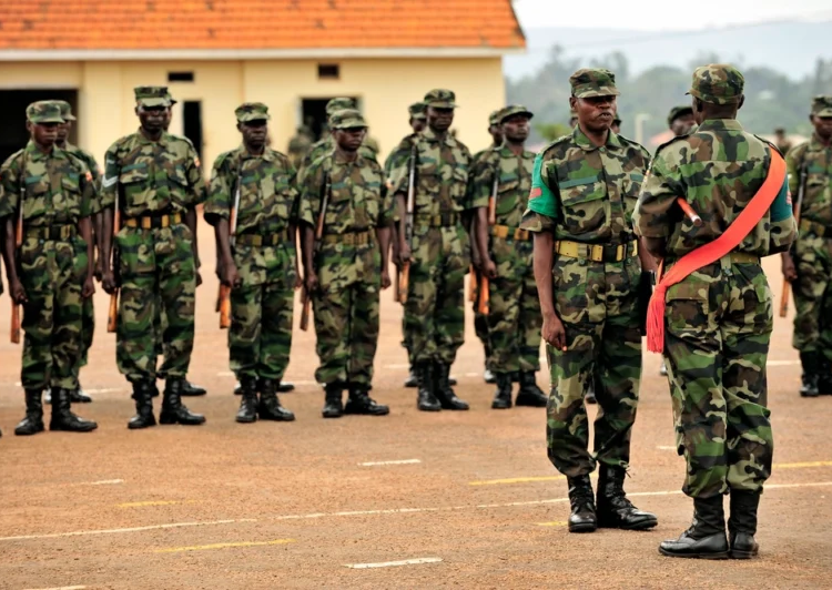 Uganda Peoples Defense Force soldiers stand in formation during a demonstration of skills learned at the UPDF Non-Commissioned Officers Academy in Jinja, Uganda, Jan. 9, 2009. U.S. Soldiers attached to Combined Joint Task Force-Horn of Africa are providing mentorship and assistance to the UPDF NCOA. (U.S. Navy photo by Petty Officer 2nd Class Jesse B. Awalt/Released)